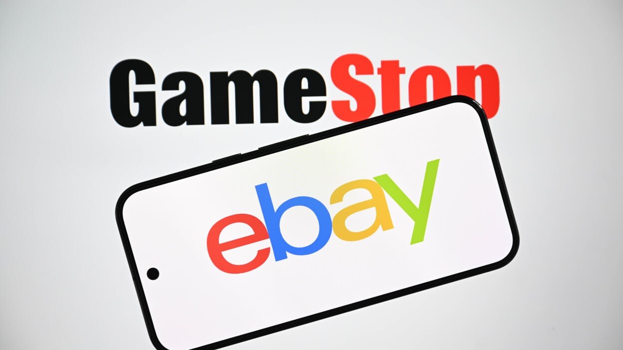 Gamestop logo is displayed in the background while the eBay logo is shown on a mobile phone screen 