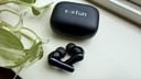 earfun air pro 4 earbuds on window sill next to plant